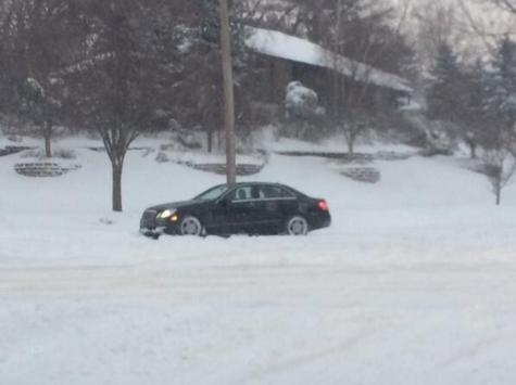 This car was stuck in the snow on Shelburne Road for more than five minutes during the morning of Feb. 18. Hutchings did not cancel school that Tuesday in part because of the high school's delayed start.