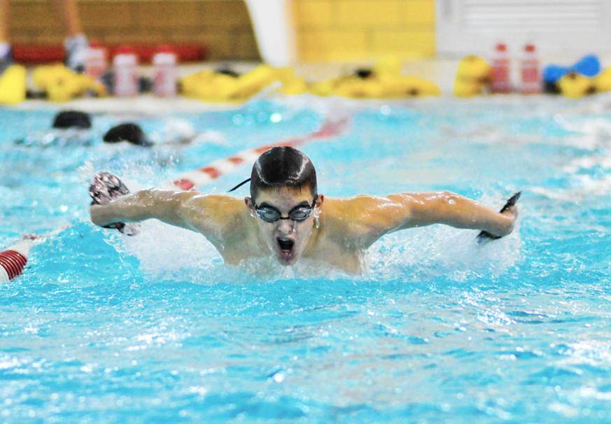 Varsity swimmer Austin Yoder, a junior, comes up for air while doing a 50-yard butterfly warm up during an afternoon swim practice Dec. 2 at the Woodbury pool. The Raiders’ first swim meet will be against Willoughby South High School Dec. 13 at home.